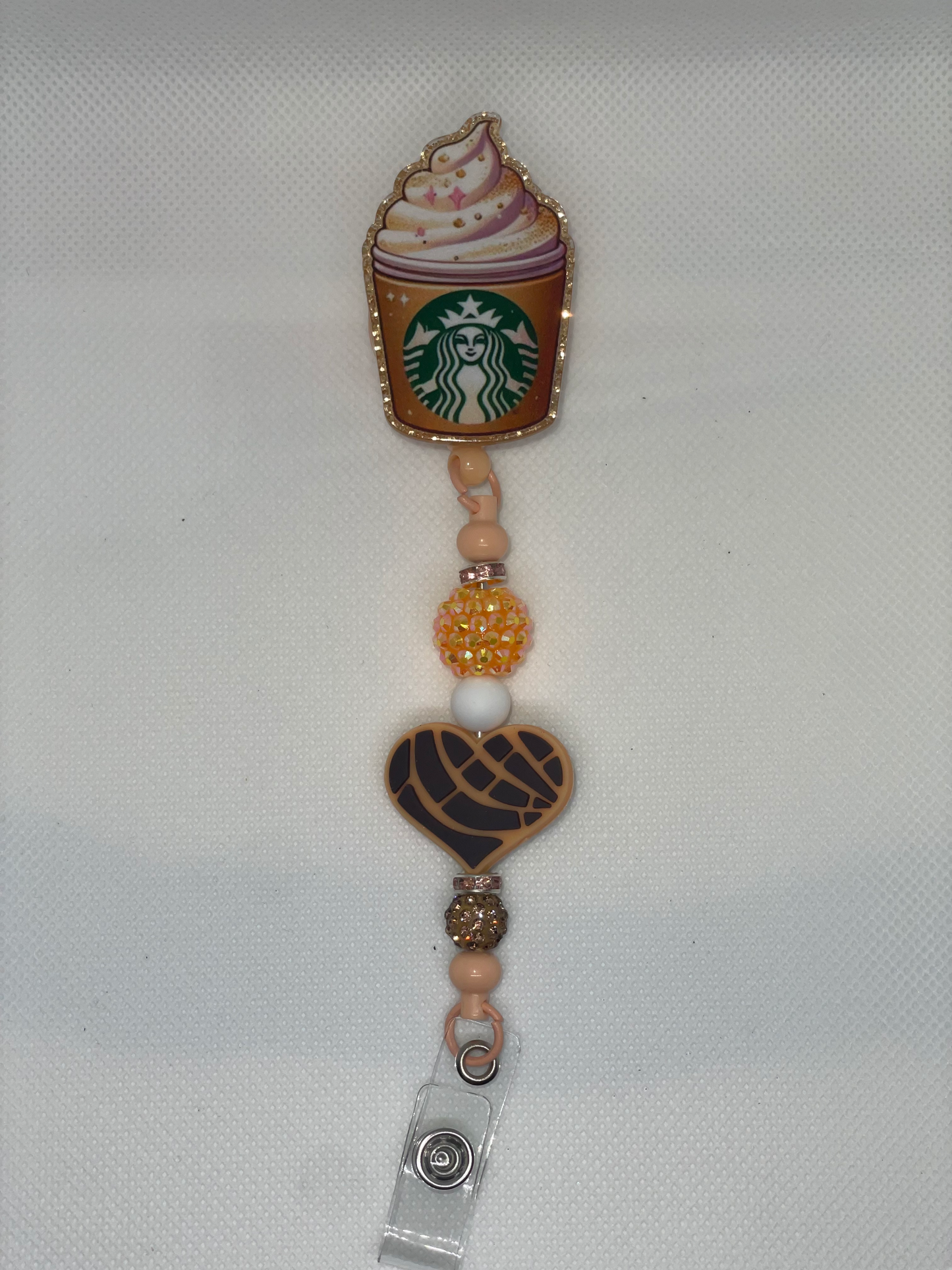Coffee and Conch orange badge reel