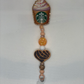 Coffee and Conch orange badge reel