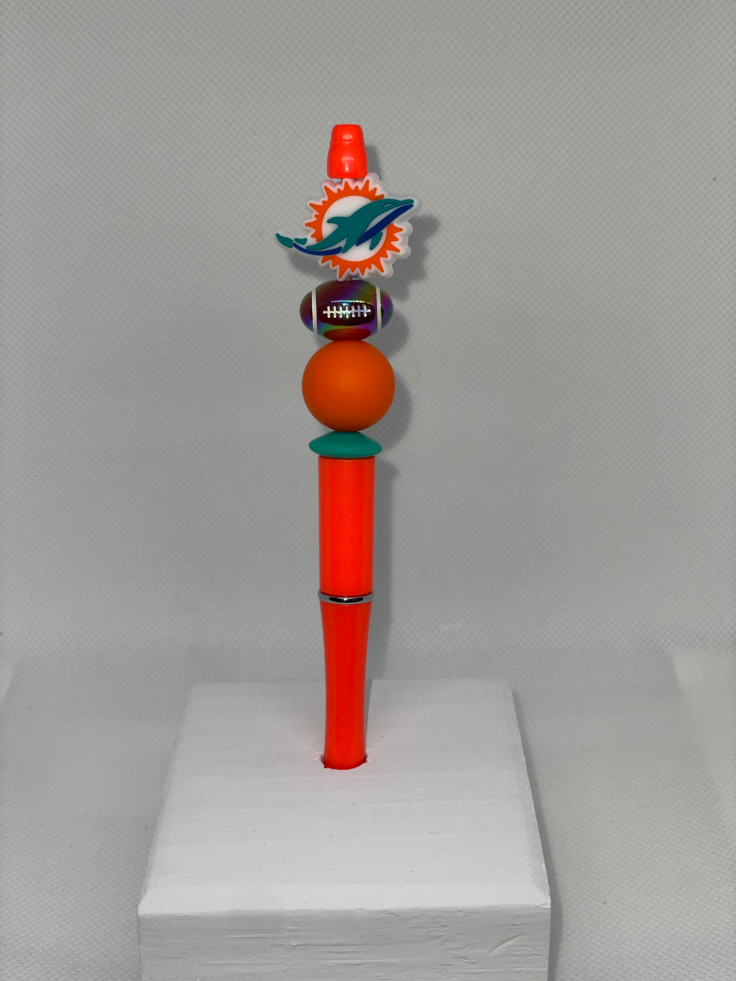 M Dolphines orange pen