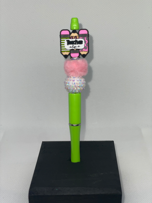 Teacher pencils green pen