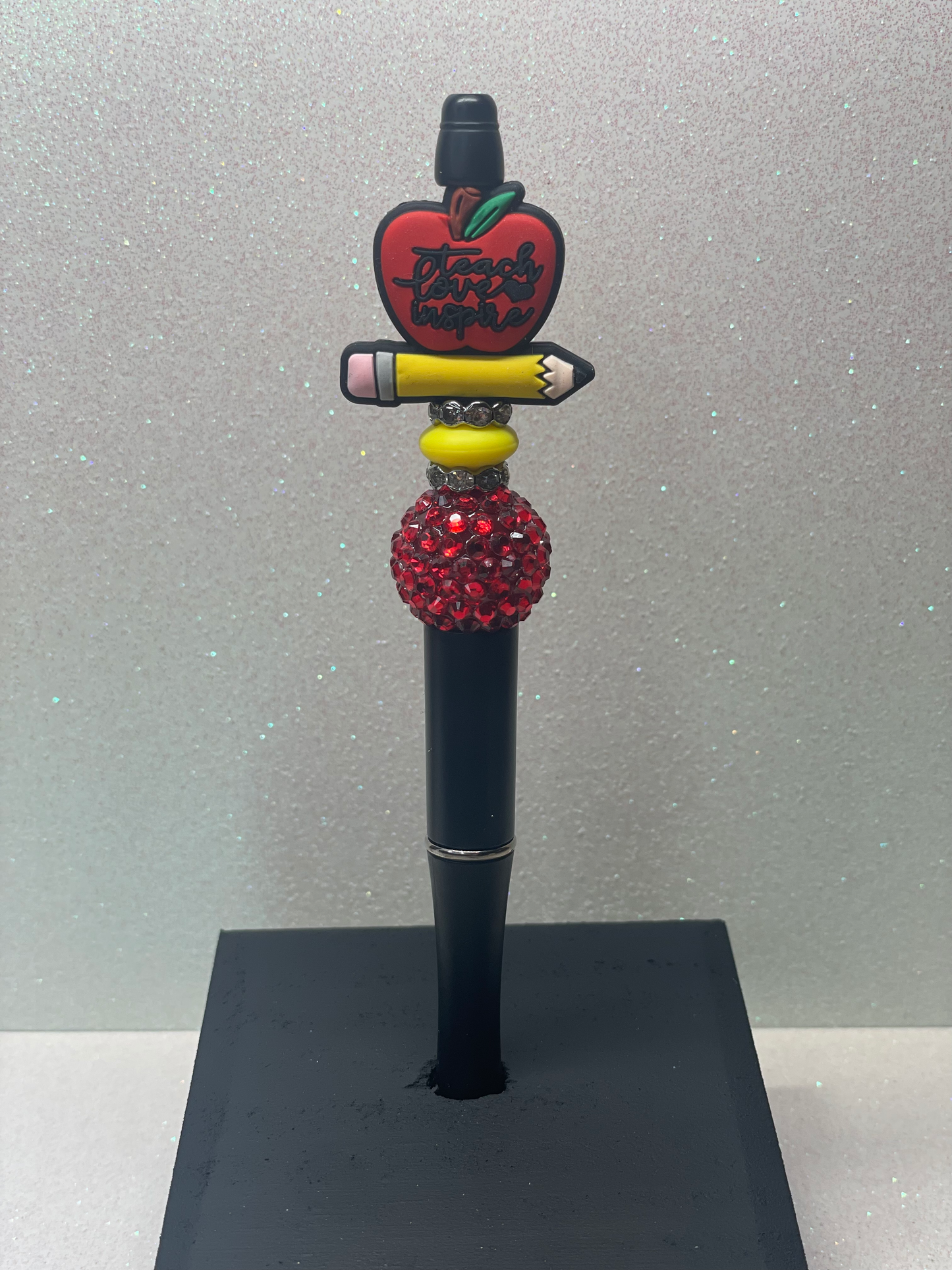 Teacher apple with pencil black pen